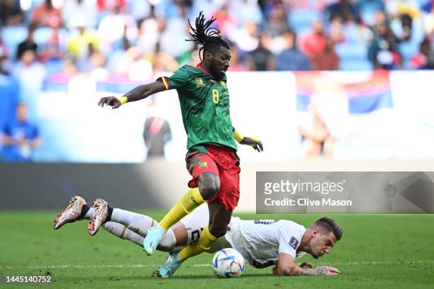 Sergej Milinkovic-Savic of Serbia is brought down by Andre-Frank Zambo Anguissa of Cameroon during the FIFA World Cup Qatar 2022 Group G match...