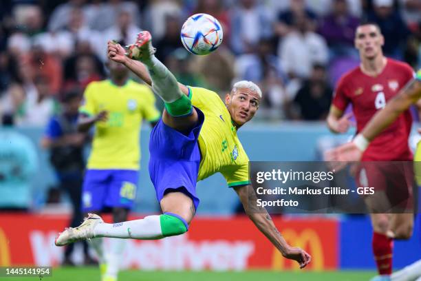 Richarlison of Brazil scores his team's second goal with a sideways scissor-kick during the FIFA World Cup Qatar 2022 Group G match between Brazil...