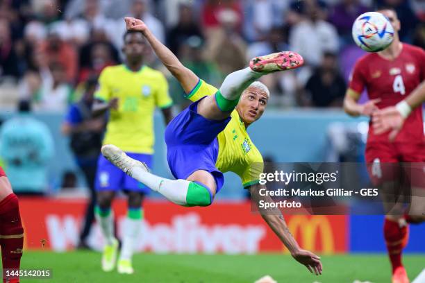 Richarlison of Brazil scores his team's second goal with a sideways scissor-kick during the FIFA World Cup Qatar 2022 Group G match between Brazil...