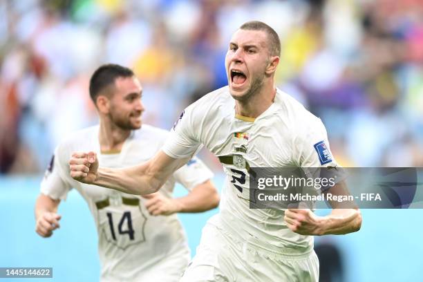 Strahinja Pavlovic of Serbia celebrates after scoring their team's first goal during the FIFA World Cup Qatar 2022 Group G match between Cameroon and...