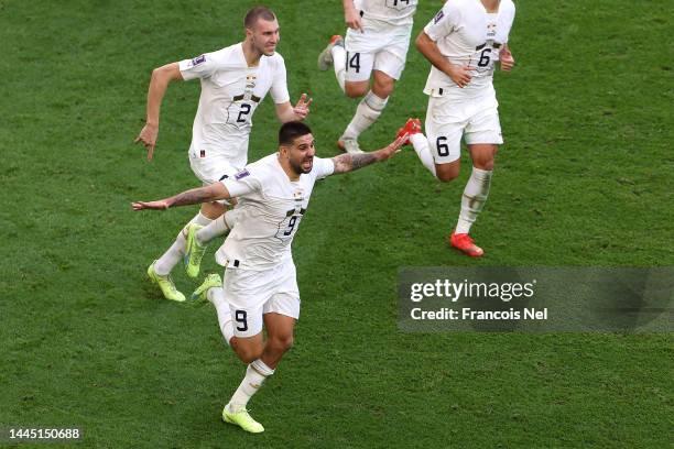 Aleksandar Mitrovic of Serbia celebrates after scoring their team's third goal during the FIFA World Cup Qatar 2022 Group G match between Cameroon...