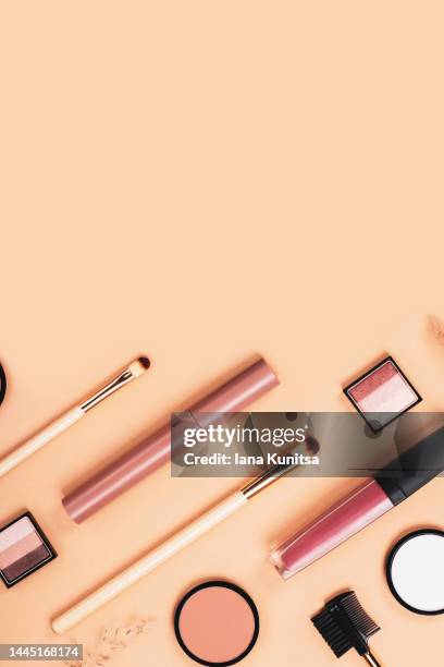 set of different makeup accessories on beige, brown background. knolling concept. cosmetic products for skin care. eyeshadow, blush, face powder, brushes and lipstick. vertical banner, copy space. - combinação cor de pele imagens e fotografias de stock