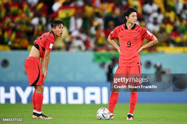 Wooyeong Jeong and Guesung Cho of Korea Republic react after Ghana's second goal during the FIFA World Cup Qatar 2022 Group H match between Korea...