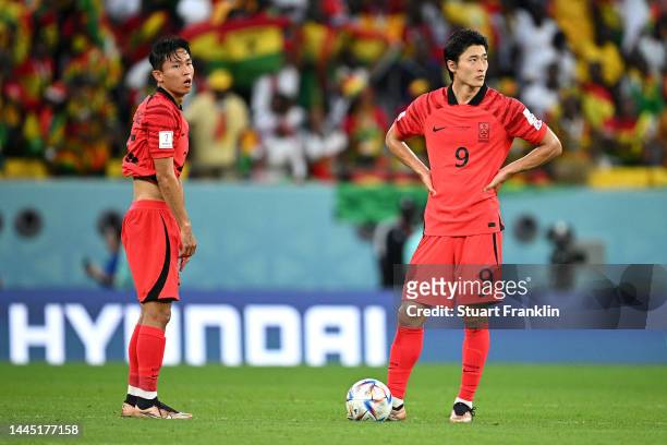 Wooyeong Jeong and Guesung Cho of Korea Republic react after Ghana's second goal during the FIFA World Cup Qatar 2022 Group H match between Korea...