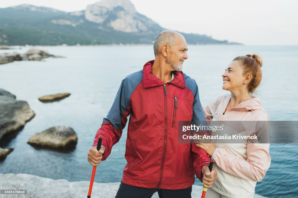Senior couple walking outdoors together.