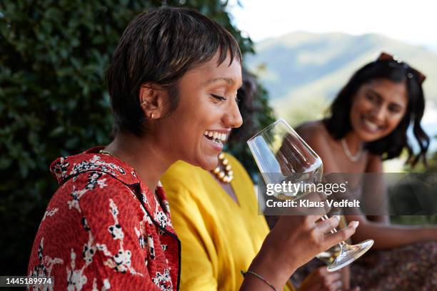 happy young woman having white wine - wine tasting stock pictures, royalty-free photos & images