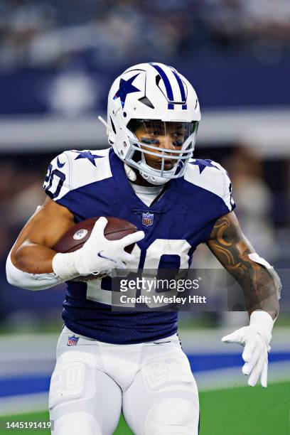 Tony Pollard of the Dallas Cowboys runs the ball during a game against the New York Giants at AT&T Stadium on November 24, 2022 in Arlington, Texas....