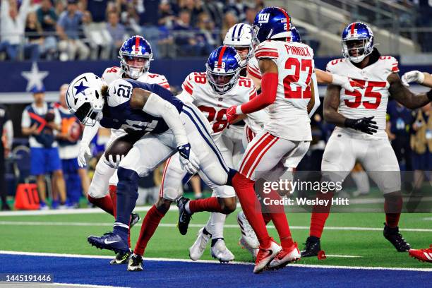 Ezekiel Elliott of the Dallas Cowboys runs the ball for a touchdown during a game against the New York Giants at AT&T Stadium on November 24, 2022 in...