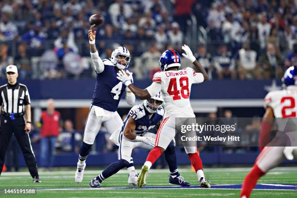 Dak Prescott of the Dallas Cowboys throws a pass during a game against the New York Giants at AT&T Stadium on November 24, 2022 in Arlington, Texas....