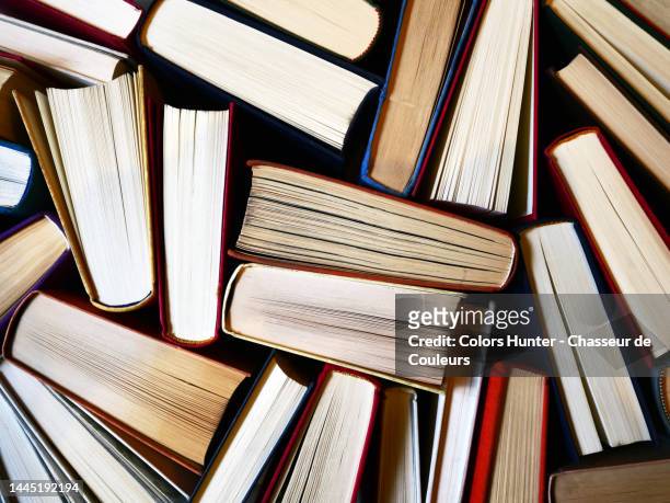 books mixed and seen from above paris - bookshelf photos et images de collection
