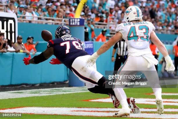 Laremy Tunsil of the Houston Texans attempts to catch a pass during the fourth quarter in the game against the Miami Dolphins at Hard Rock Stadium on...