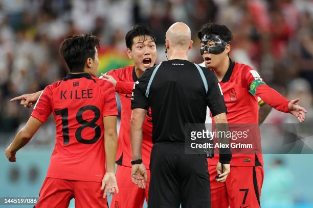 Heungmin Son of Korea Republic argues a call with referee Anthony Taylor during the FIFA World Cup Qatar 2022 Group H match between Korea Republic...