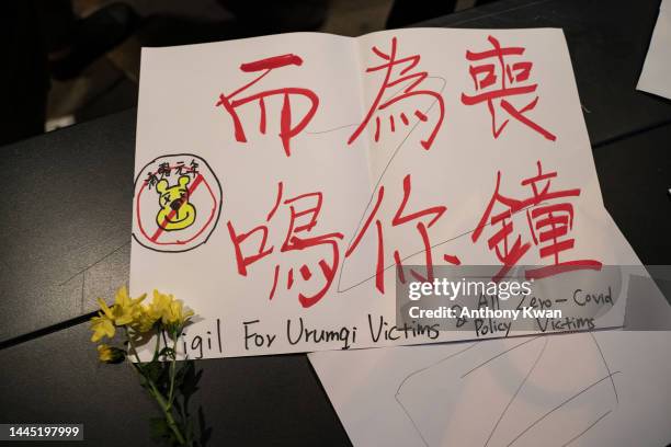 Message for the victims of Urumqi fire is placed at a vigil in the central district on November 28, 2022 in Hong Kong, China. Protesters took to the...