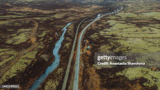 aerial view of the cars driving the scenic curvy mountiain highway in the tundra of norway - trøndelag stock pictures, royalty-free photos & images