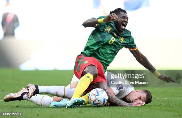 Andre-Frank Zambo Anguissa of Cameroon and Sergej Milinkovic-Savic of Serbia compete for the ball during the FIFA World Cup Qatar 2022 Group G match...