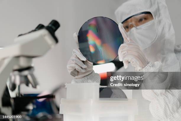 chip engineer is taking wafer out from box - ic testing stock pictures, royalty-free photos & images