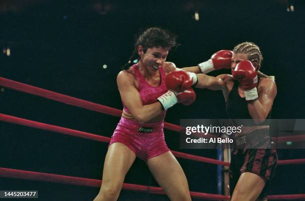 Boxer Mia Rosales St John from the United States and Kristin Allan trade punches during their Super Featherweight fight on 26th February 2000 at the...