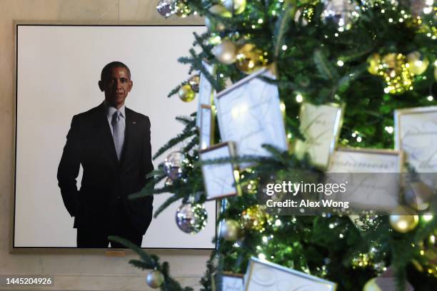 Portrait of former U.S. President Barack Obama is seen with Christmas decorations at the White House during a press preview of the holiday décor on...