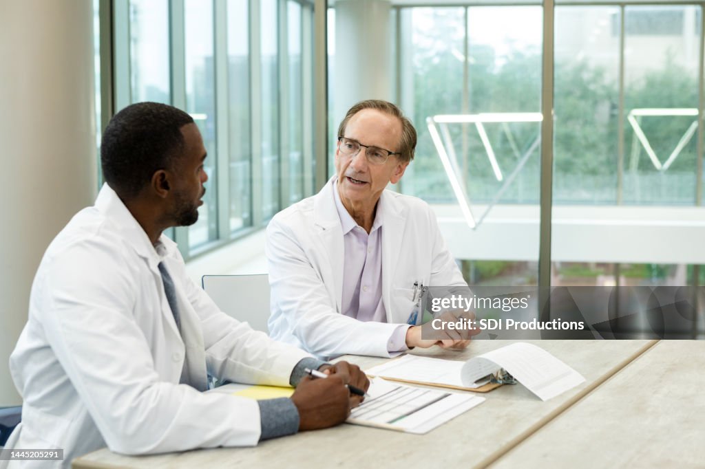 Two Physicians Two Physicians Meet High-Res Stock Photo - Getty Images