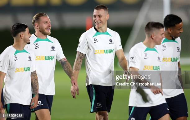 Mitchell Duke and Jason Cummings of Australia interact during the Australia Training Session at Aspire Training Facilities on November 28, 2022 in...