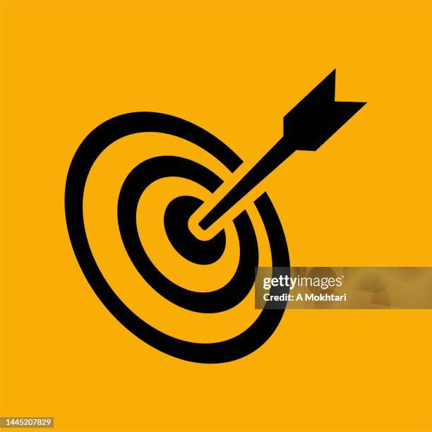 target icon with a dart, strategy, on a yellow background. - dart stock illustrations