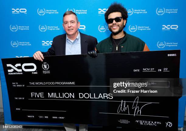 In this image released on Nov.28 Barron Segar, President and CEO, World Food Program USA and Abel “The Weeknd” Tesfaye pose backstage during the...