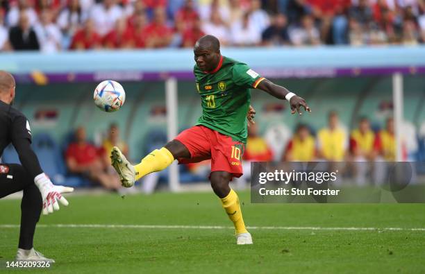 Cameroon player Vincent Aboubakar shoots to score the second Cameroon goal during the FIFA World Cup Qatar 2022 Group G match between Cameroon and...