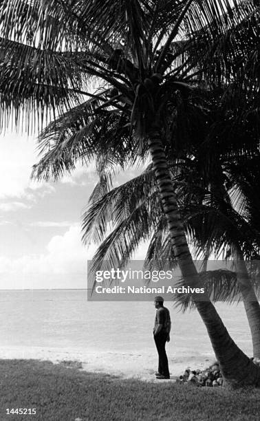 President Richard Nixon looks at the ocean on a beach November 8, 1971 in Key Biscayne, FL.