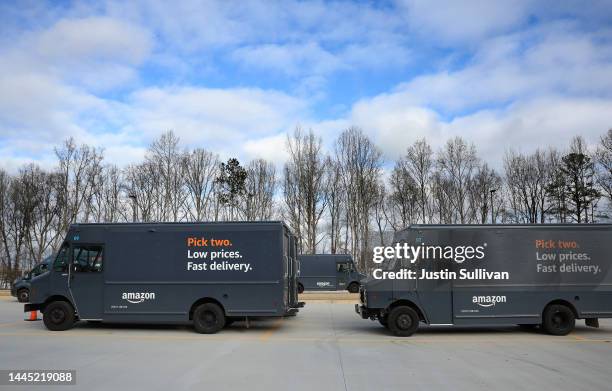 Amazon line up to pick up packages at an Amazon delivery station on November 28, 2022 in Alpharetta, Georgia. Amazon is offering deep discounts on...