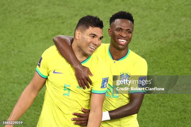 Casemiro of Brazil celebrates after scoring their team's first goal with their teammate Vinicius Junior during the FIFA World Cup Qatar 2022 Group G...