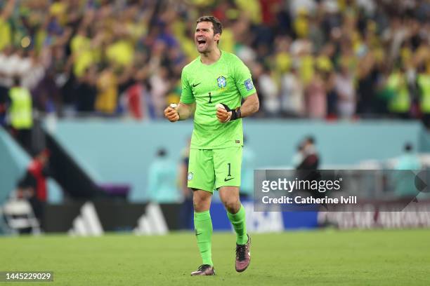 Alisson Becker of Brazil celebrates their first goal by Casemiro during the FIFA World Cup Qatar 2022 Group G match between Brazil and Switzerland at...