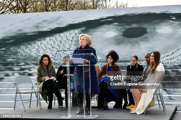 Hillary Rodham Clinton speaks as Sepideh Moafi, Zainab Salbi, Sheida Soleimani, Shirin Neshat, Hank Willis Thomas and Nazanin Afshin-Jam look on...