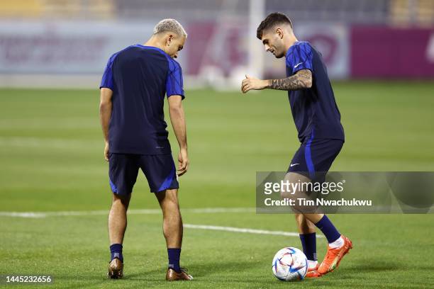 Christian Pulisic and Sergino Dest of United States train during the USA Training Session at Al Gharafa Stadium on November 28, 2022 in Doha, Qatar.