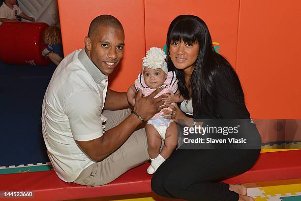 Wide receiver Victor Cruz, daughter Kennedy Cruz and girlfriend Elaina Watley attend Pampers "Spirit of Play" Event In Celebration Of The London 2012...