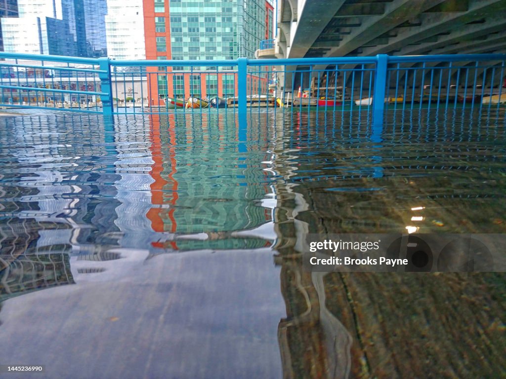Boston's Harborwalk in the Seaport is underwater at high tide.