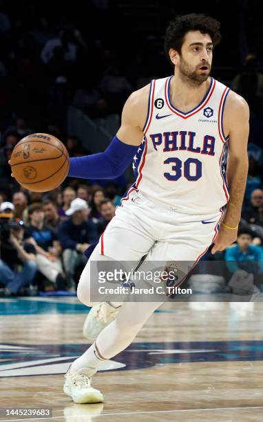 Furkan Korkmaz of the Philadelphia 76ers brings the ball up court during the second half of the game against the Charlotte Hornets at Spectrum Center...