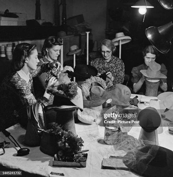 Millinery student Pamela Warren of Bromley School of Art, in the work room at at West End milliners, Erik, where she is on work experience, Brook...