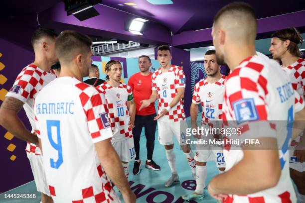 Ivan Perisic of Croatia speaks with teammates as they prepare to enter the pitch for the second half during the FIFA World Cup Qatar 2022 Group F...