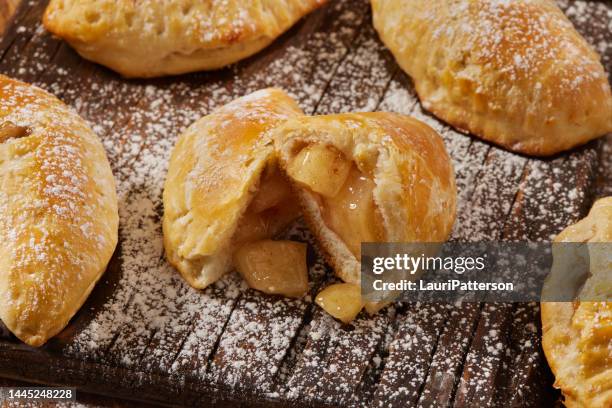 baked apple pie hand pies - stuffing stock pictures, royalty-free photos & images