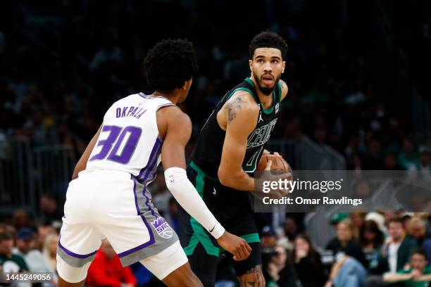 Jayson Tatum of the Boston Celtics looks to pass during the third quarter of the game against the Sacramento Kings at TD Garden on November 25, 2022...