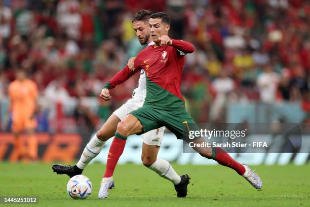 Cristiano Ronaldo of Portugal battles for possession with Rodrigo Bentancur of Uruguay during the FIFA World Cup Qatar 2022 Group H match between...