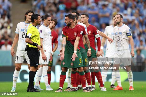 Bruno Fernandes of Portugal argues with Alireza Faghani during the FIFA World Cup Qatar 2022 Group H match between Portugal and Uruguay at Lusail...
