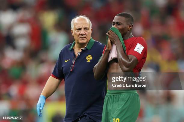 Nuno Mendes of Portugal sheds tears as he is substituted after picking up an injury during the FIFA World Cup Qatar 2022 Group H match between...