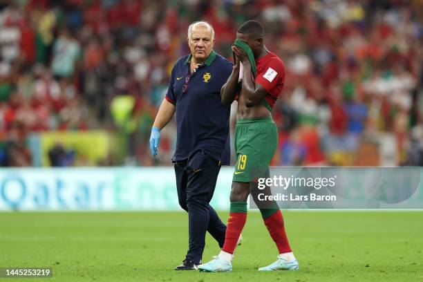 Nuno Mendes of Portugal sheds tears as he is substituted after picking up an injury during the FIFA World Cup Qatar 2022 Group H match between...