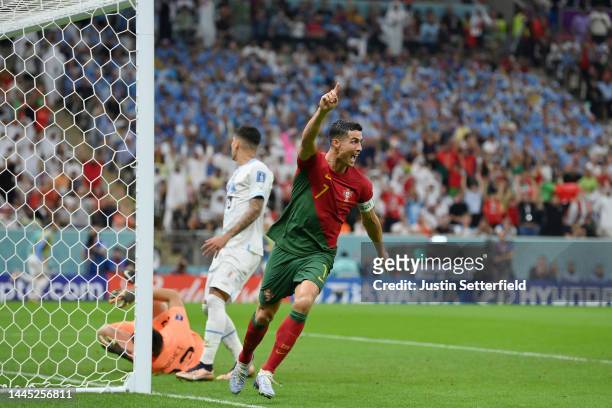 Cristiano Ronaldo of Portugal celebrates their team's first goal by Bruno Fernandes during the FIFA World Cup Qatar 2022 Group H match between...