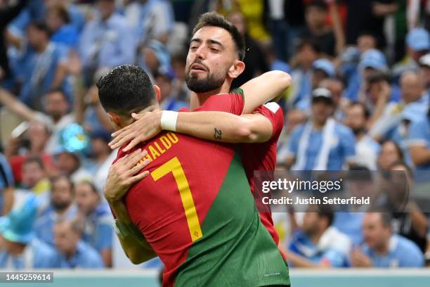 Bruno Fernandes of Portugal celebrates scoring his side's first goal with his teammate Cristiano Ronaldo during the FIFA World Cup Qatar 2022 Group H...