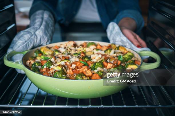 preparing farmers harvest chicken casserole - ovenschotel stockfoto's en -beelden