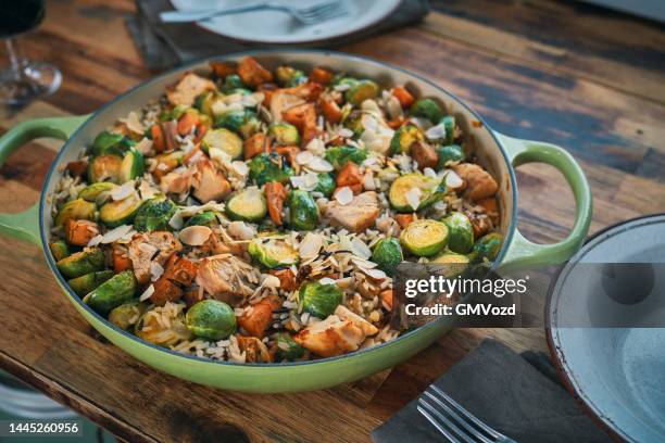 preparing farmers harvest chicken casserole - wilde rijst stockfoto's en -beelden