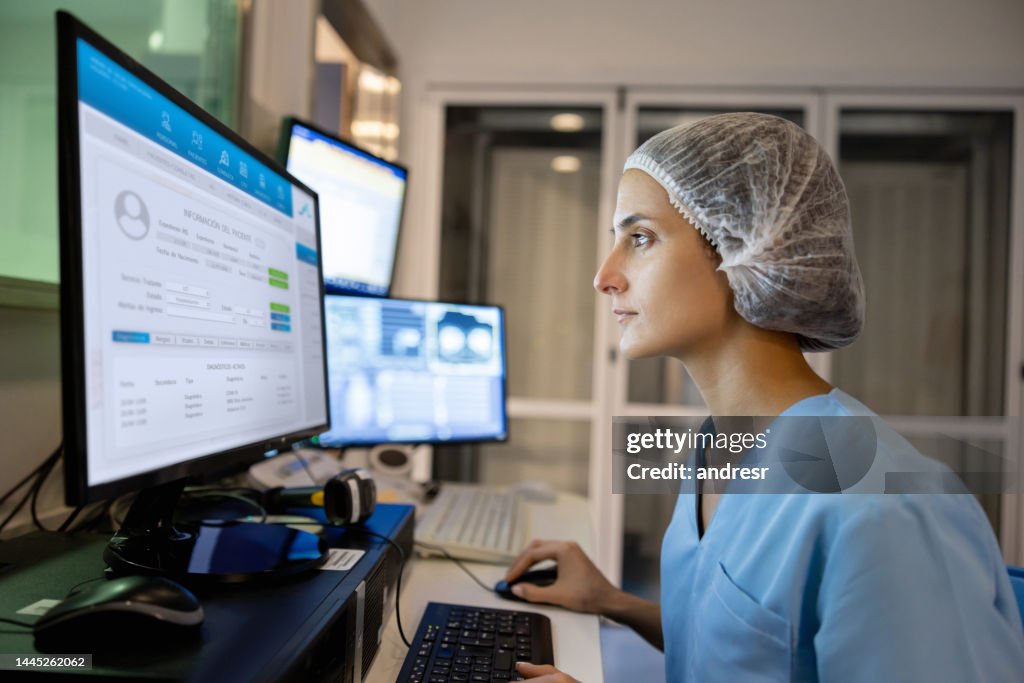 Radiologist in the control room performing a medical scan