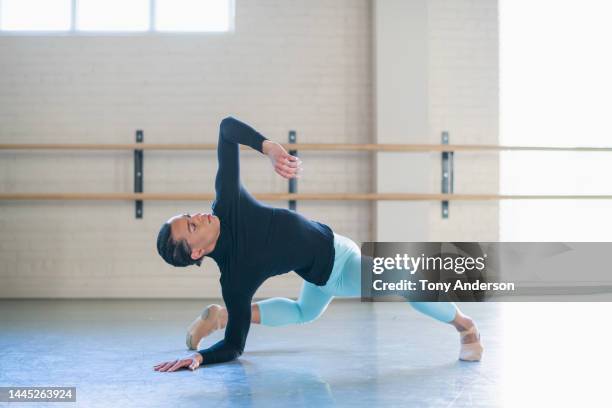 young man ballet dancer working in dance studio - handsome native american men stock-fotos und bilder